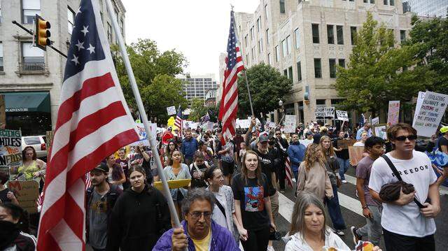 A large crowd marches through downtown streets during the No Kings Rally in Fort Worth on Friday, Oct. 17, 2025."
